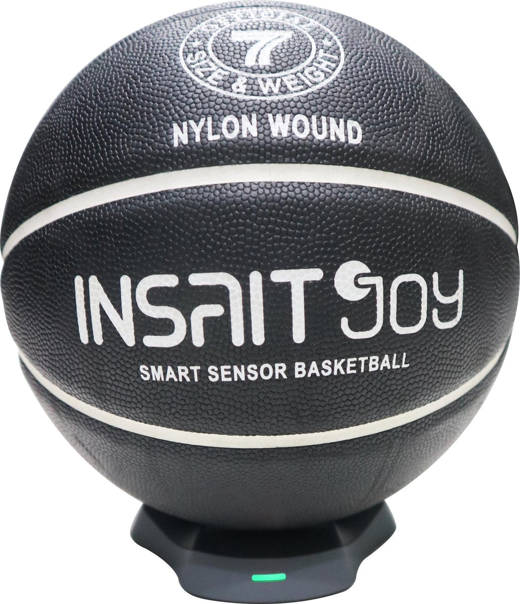 INSAIT JOY Smart Basketball size 7 on its wireless charging base